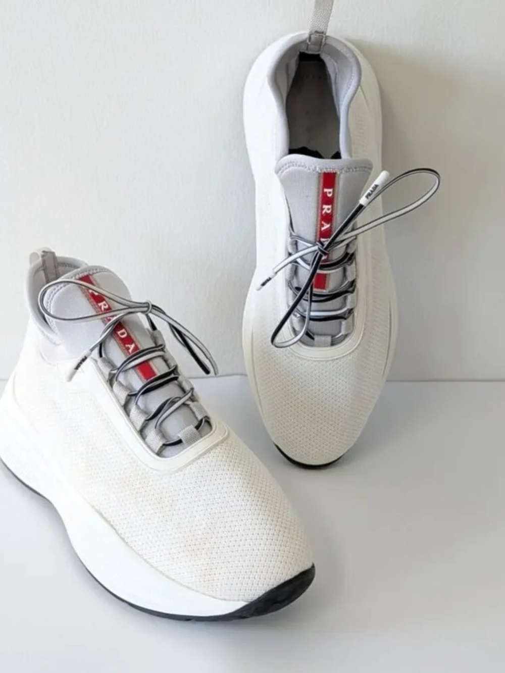 Prada White Knit Sneakers with Red Tongue Stripe Accent